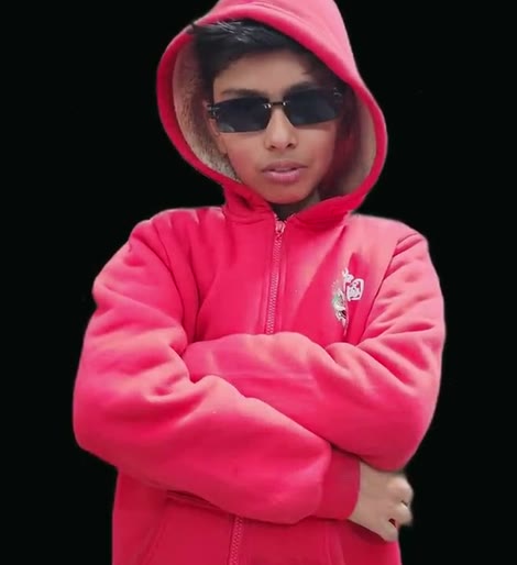 Vansh in a red hoodie and sunglasses, arms folded
