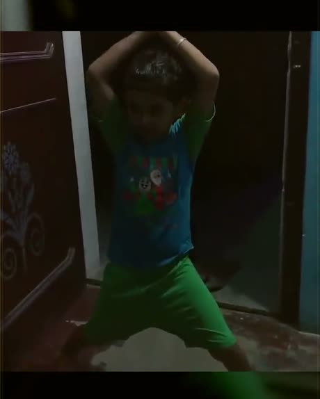 Vansh dancing with his arms in the air